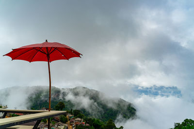 Scenic view of red and mountains against sky