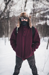 Portrait of a person standing on snow