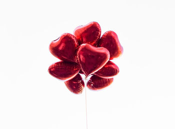 Close-up of heart shape over white background