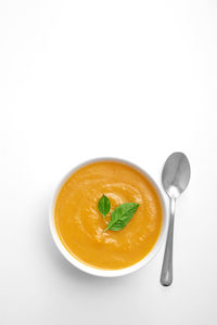 Directly above view of soup in bowl on white background