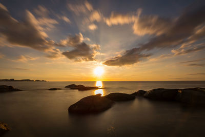 Scenic view of sea against sky during sunset