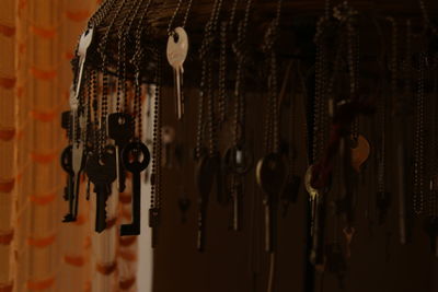 Close-up of lighting equipment hanging in row