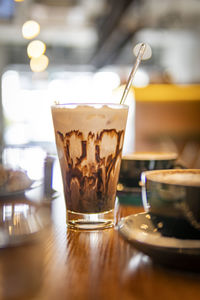 Close-up of coffee served on table at cafe