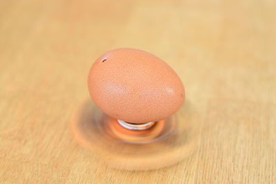 Close-up of egg on wooden table