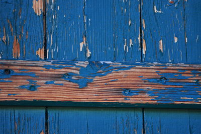 Full frame shot of weathered wooden door