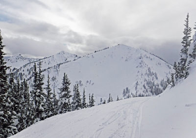 Scenic view of snow covered mountain against sky