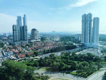 High angle view of buildings in city against sky