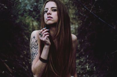  woman smoking outdoors