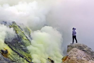 Person standing on mountain landscape