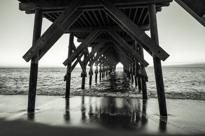 Pier over sea against sky