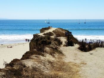 Scenic view of beach against clear sky