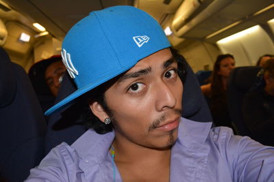 Young woman sitting in airplane