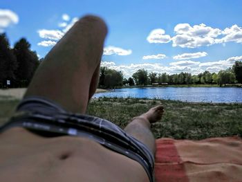 Low section of people relaxing on lake