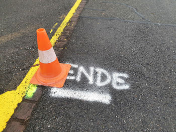 High angle view of road sign on street