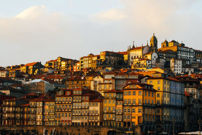 Buildings in city against sky