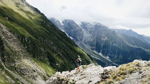 Full length of woman standing on mountain