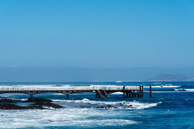 Pier in the beach of corralejo in fuerteventura