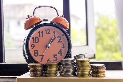 Close-up of clock on table