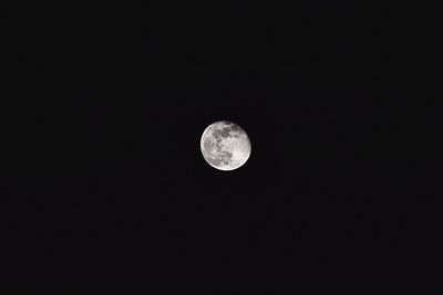 Low angle view of moon against sky at night