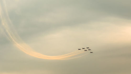 Low angle view of airplane flying in sky