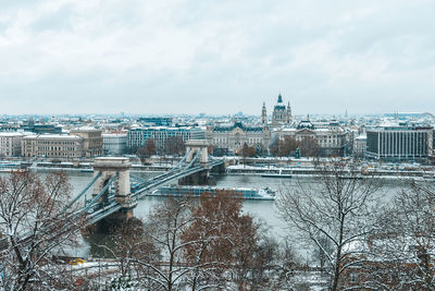 Panoramic view of budapest city and chain bridge on a frosty snowy winter morning