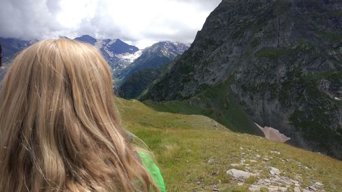 Rear view of woman looking at mountains