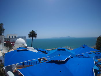 Panoramic view of sea against clear blue sky