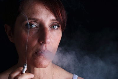 Close-up of woman smoking