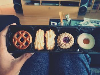 High angle view of hand holding food