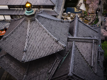 High angle view of illuminated roof and building in city