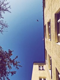 Low angle view of building against clear blue sky