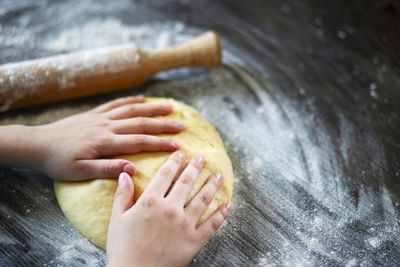 Cropped hands of person preparing food