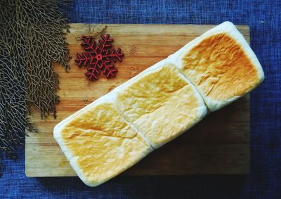 High angle view of bread on cutting board