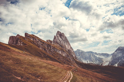 View of mountain range against cloudy sky