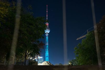 Low angle view of illuminated fernsehturm at night