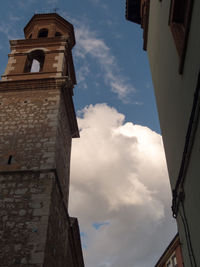 Low angle view of bell tower against sky