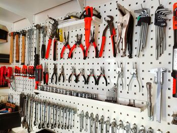 Work tools hanging on wall at workshop