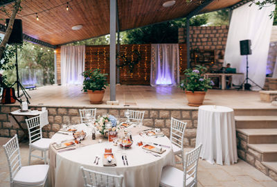 Empty chairs and tables in restaurant