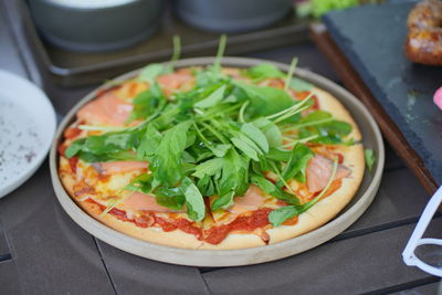 High angle view of pizza in plate on table