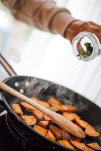 Close-up of person preparing food