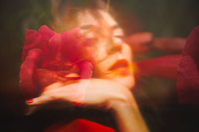 Double exposure image of woman with flowers