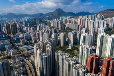 Panoramic shot of modern buildings in city against sky