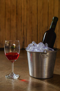 Close-up of wine glasses on table