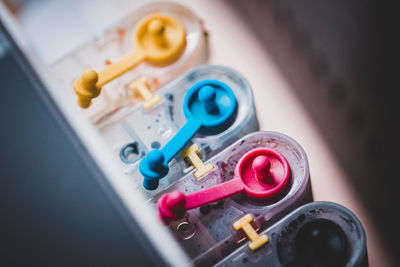 High angle view of multi colored buttons on table