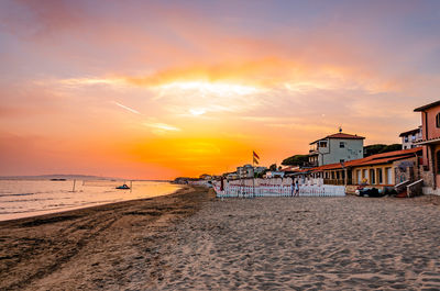 Scenic view of beach against sky during sunset