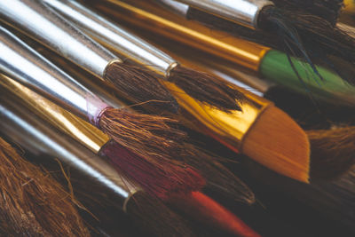 High angle view of paintbrushes on table