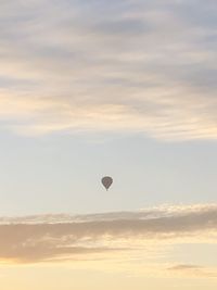 Low angle view of hot air balloon against sky during sunset