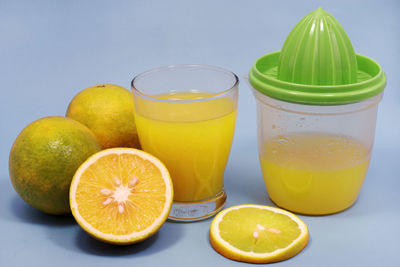 Close-up of fruits with drink on table