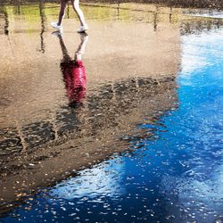 Low section of person on wet water