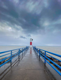 Pier over sea against sky